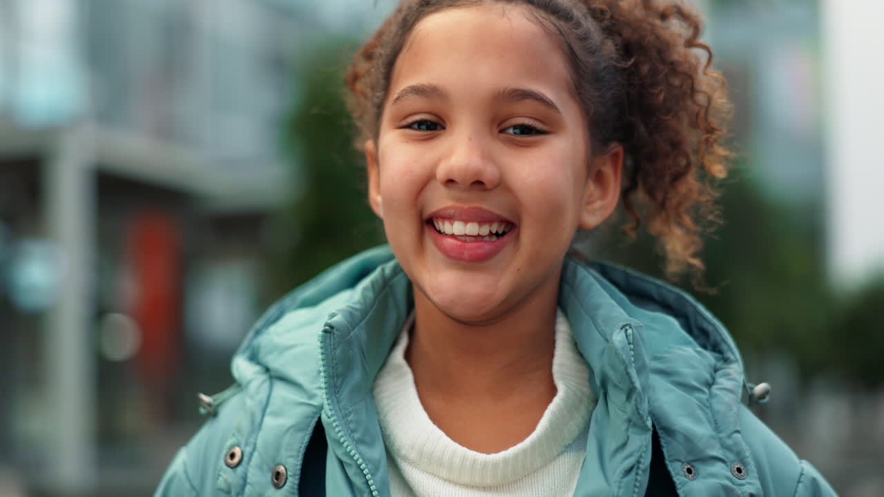 Portraits of a Smiling Young Girl with Curly Hair