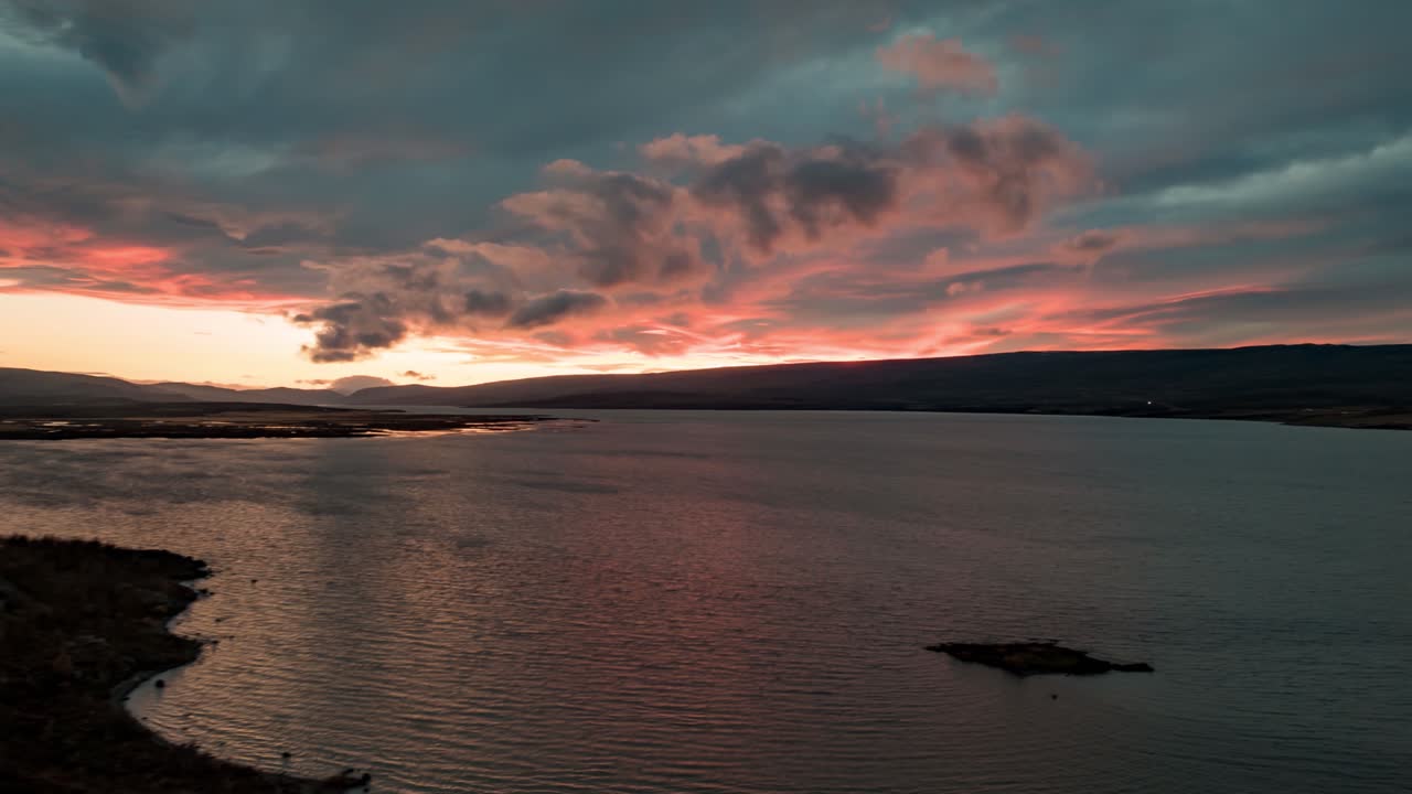 Sunset over the Lagarfljot River in Iceland - motion, aerial hyper lapse