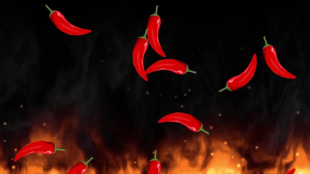 Peperoncini rossi cadono attraverso fumo scuro sopra intense fiamme arancioni su sfondo nero.