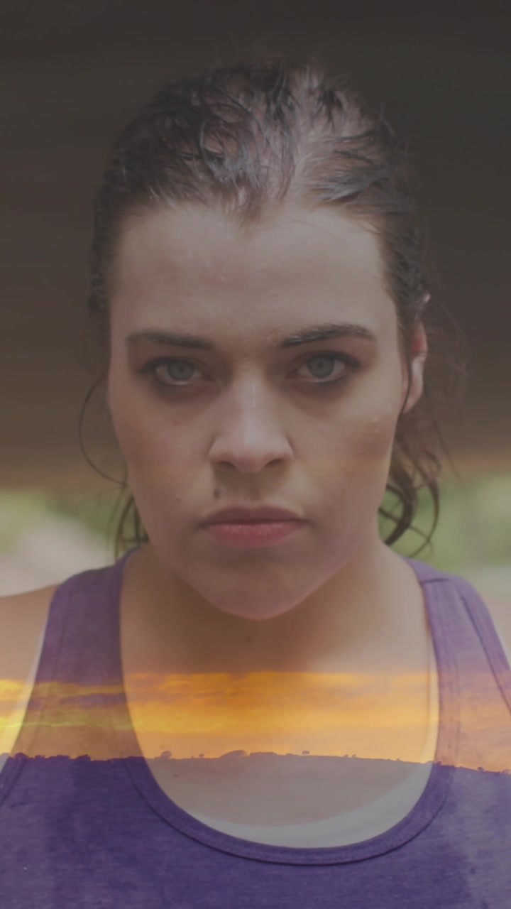 Animation of sun setting over plus size caucasian woman exercising in city