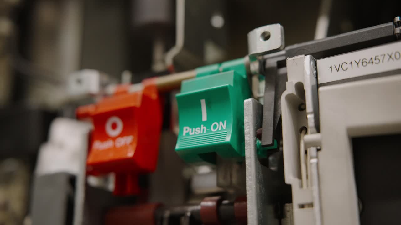 Close-up of push buttons in industrial setting, focus on operations
