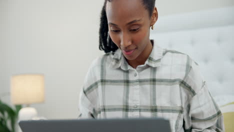 Bed,-relax-and-black-woman-typing-on-laptop