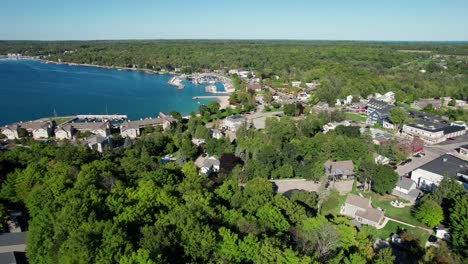 drone aerial shot overlooking all of the city of sister bay, wisconsin