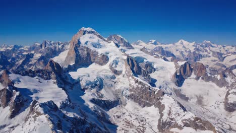 majestic snow-capped mountains under a clear blue sky