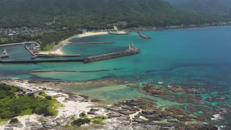 Tsukasaki-Tide-pool-and-Kurio-Town-and-Port,-Aerial-View-of-Yakushima-Japan