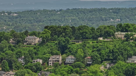 Birmingham-Alabama-Aerial-v33-cinematic-fly-around-redmont-park-neighborhood-capturing-wooded-hillside-residential-homes-with-century-old-historic-architectures---Shot-with-Mavic-3-Cine---May-2022