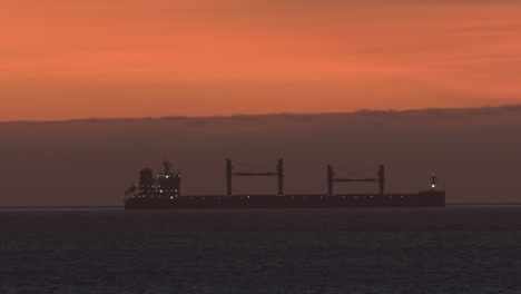 authentic fishing boat at sunset on atlantic sea