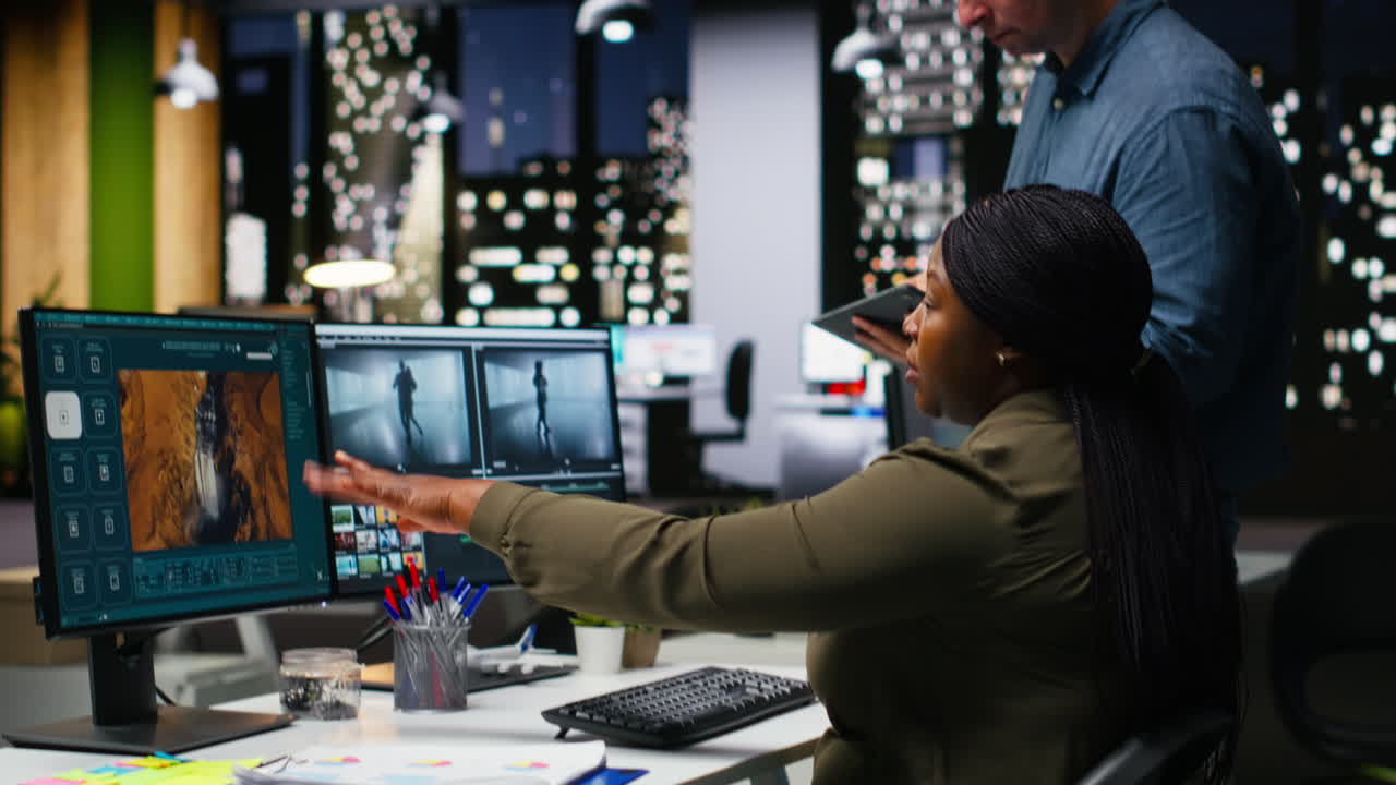 Professional video editing team works on film montage on software in office