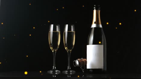 Animation-Von-Goldenen-Punkten-über-Champagner-Und-Glas-Auf-Schwarzem-Hintergrund