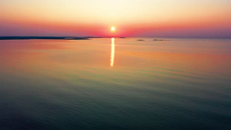 Sunset-Colors-Reflecting-off-Ocean-Waves-Along-the-Coastline