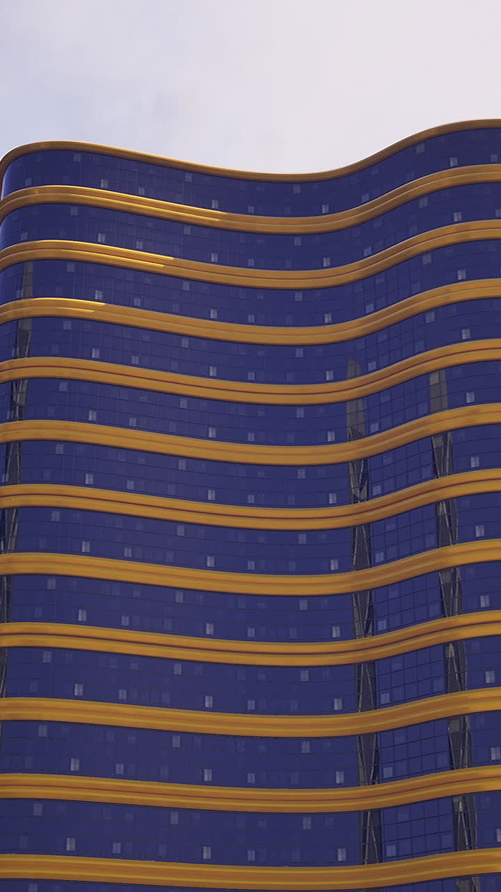 Modern skyscrapers with unique architectural designs under a clear sky