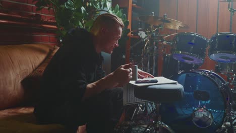 musician composing music in a home studio