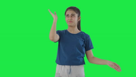 Frustrated-Indian-teenage-girl-flying-a-bee-Green-screen