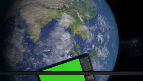 iron hatch opens panoramic view to the television set in the space. television set scanning and monitoring the earth from space. the tv with green screen orbiting the earth planet.