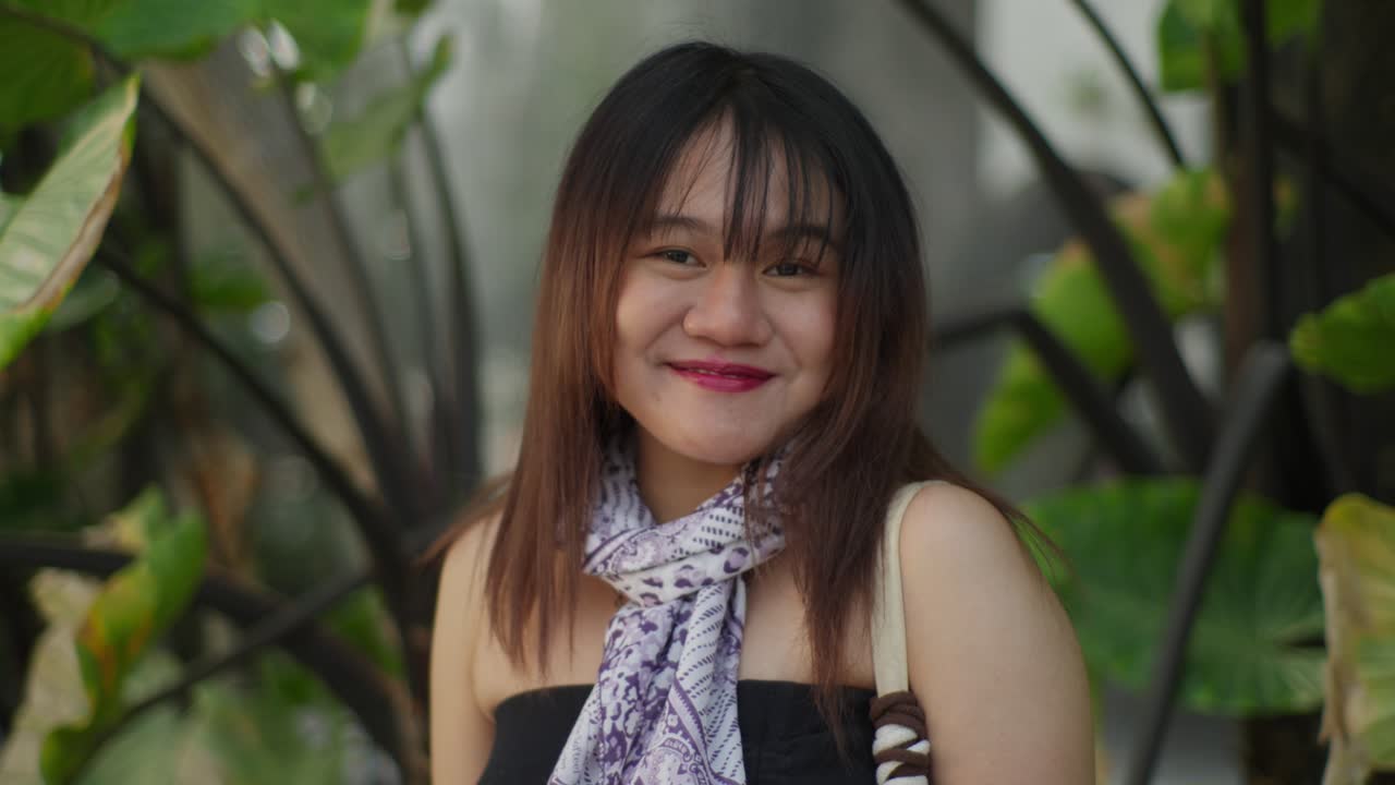 Asian girl in the foreground against a backdrop of nature and water