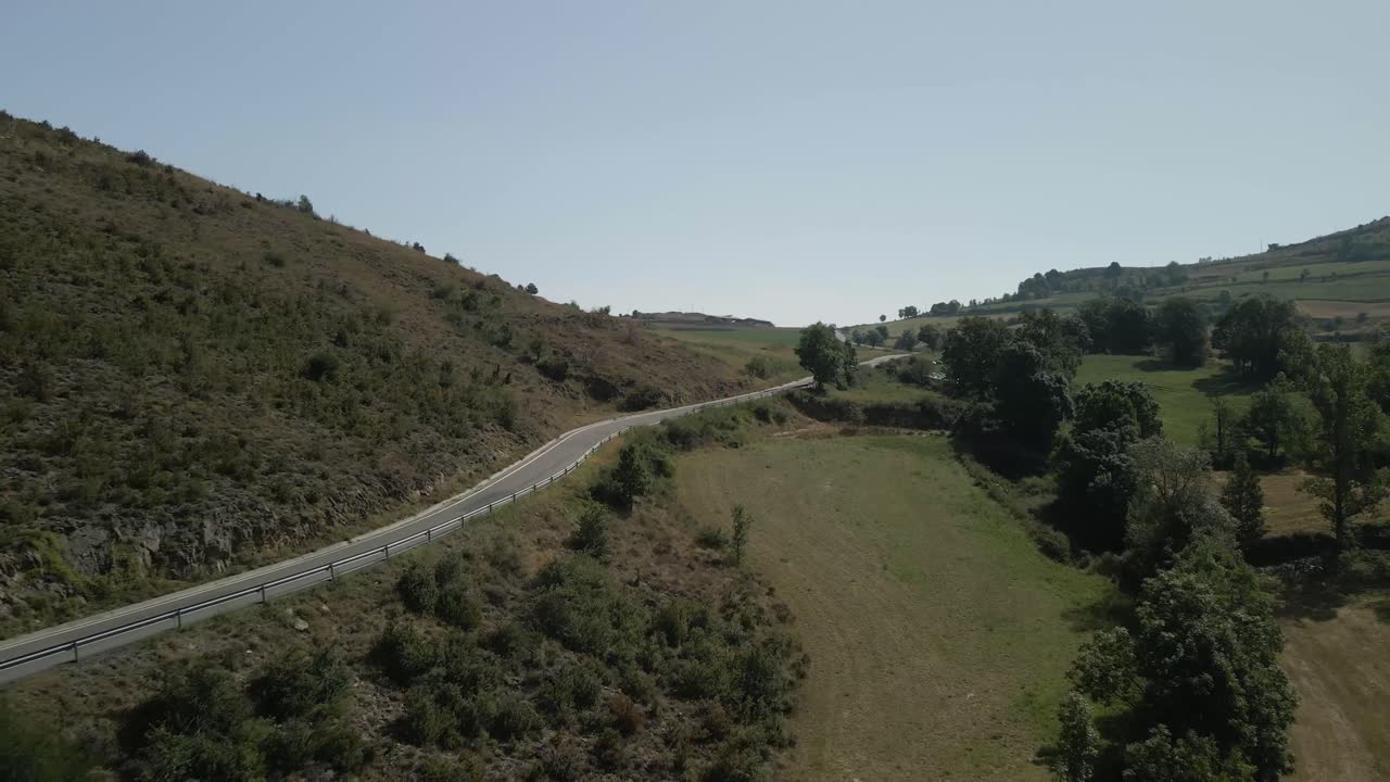 Aerial view following a mountain road on the countryside in Montella, La Cerdanya, Catalunya 4k
