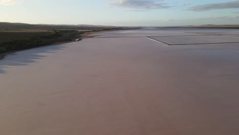 Drone-aerial-over-dry-pink-salt-lake-in-Australia-with-salt-ridges
