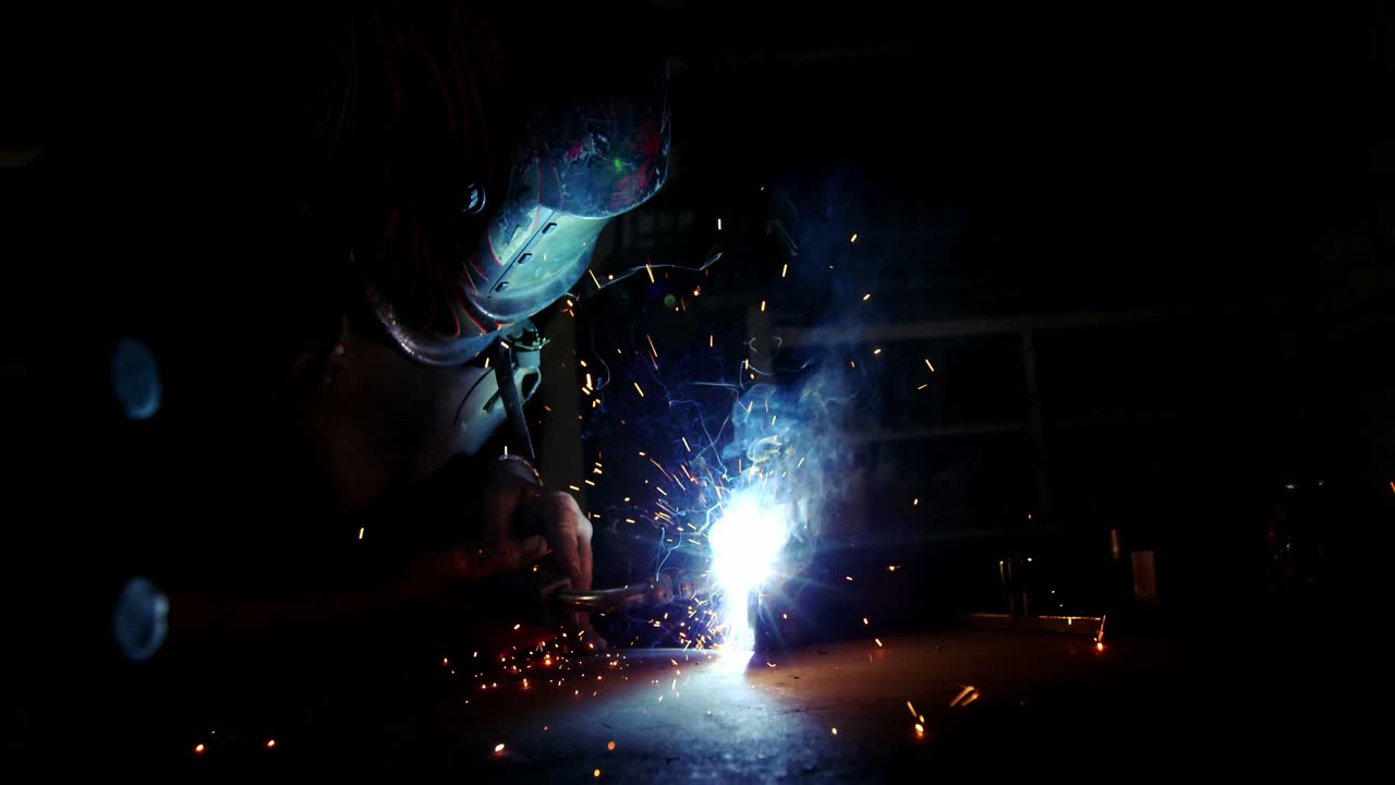 Welder working on a piece of metal