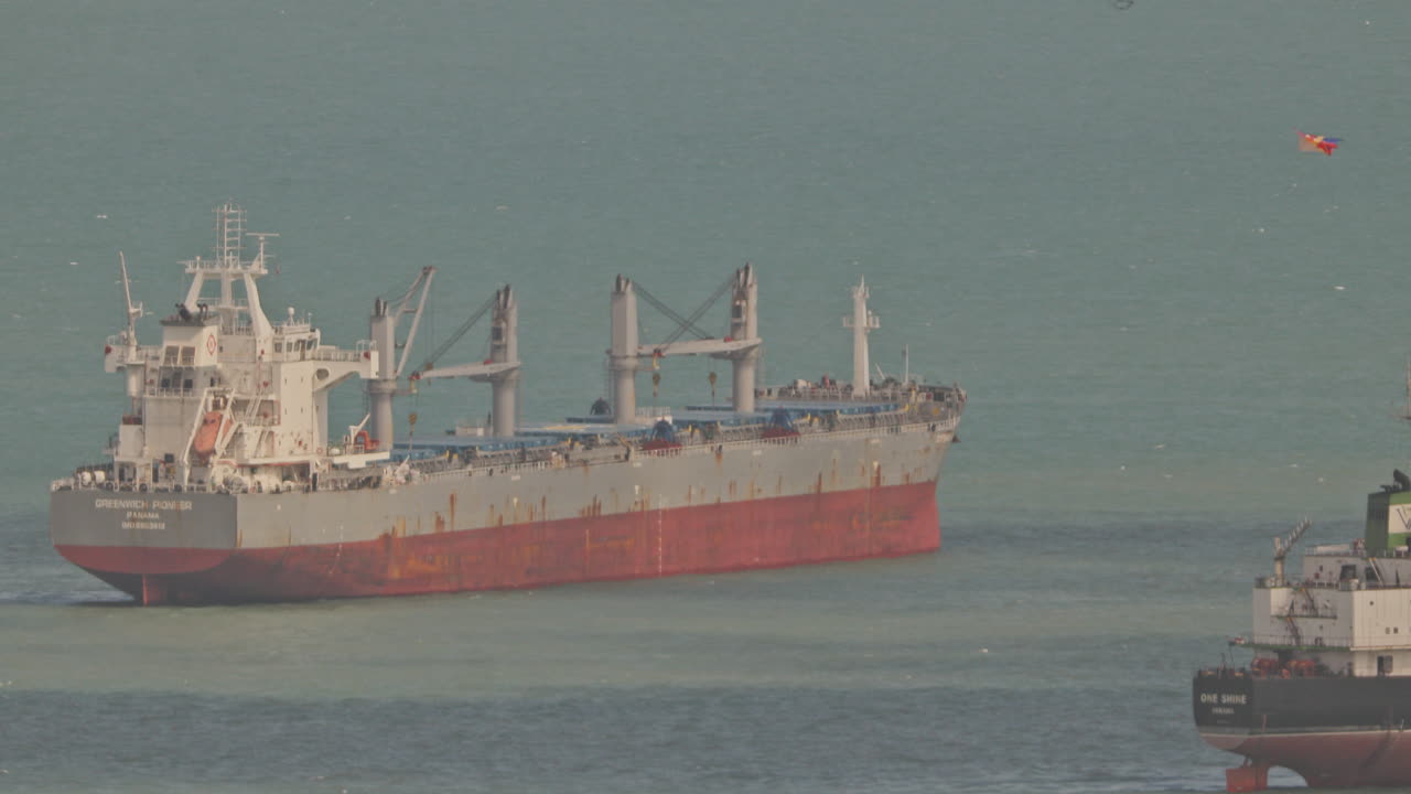 SINGAPORE - 5 MARCH 2025 : container ships waiting in the sea by singapore