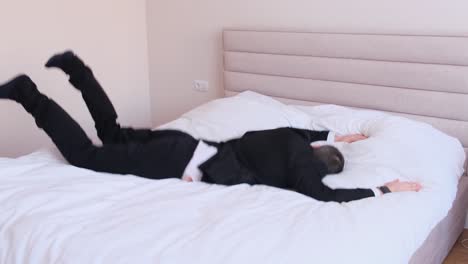 the office worker goes to bed he is tired after work the office worker goes to bed he is tired after work a tired person goes to sleep slow motion