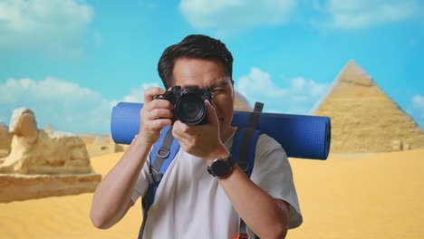 tourist taking photo of the pyramids in egypt
