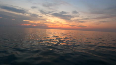 beautifully shimmering water on boat trip at sunset in thailand