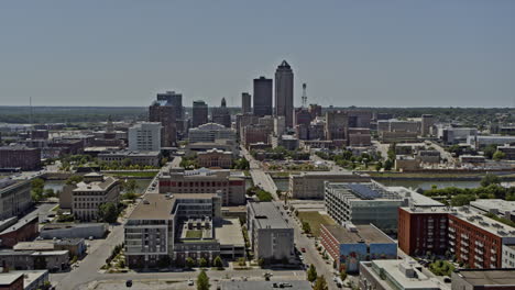 des moines iowa aerial push in flight over the river and downtown towards the skyscrapers and 801 grand - 6k professional footage - august 2020