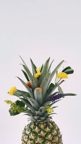 pineapple with flowers arrangement