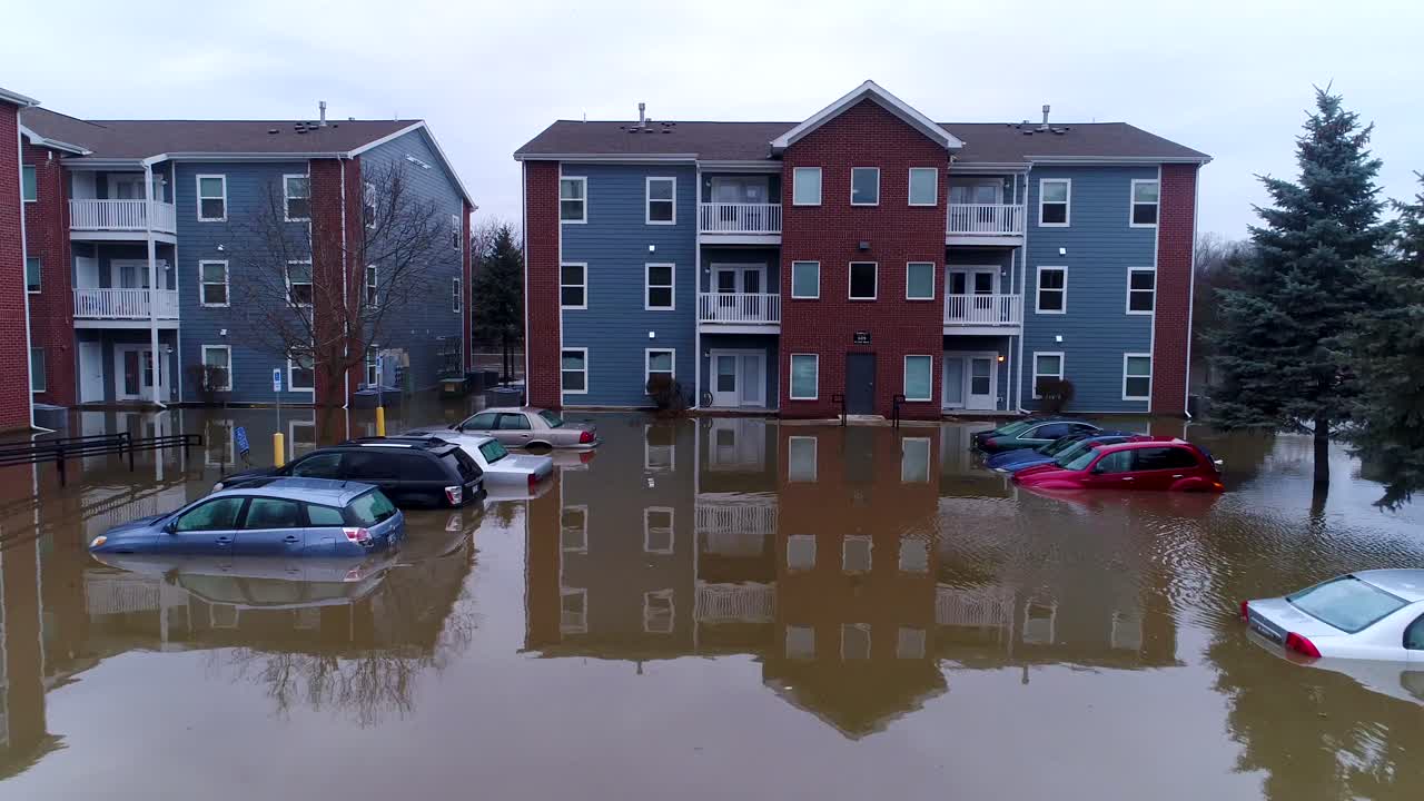 aerial drone flooded cars apartments river rain natural disaster drone stranded insurance claim