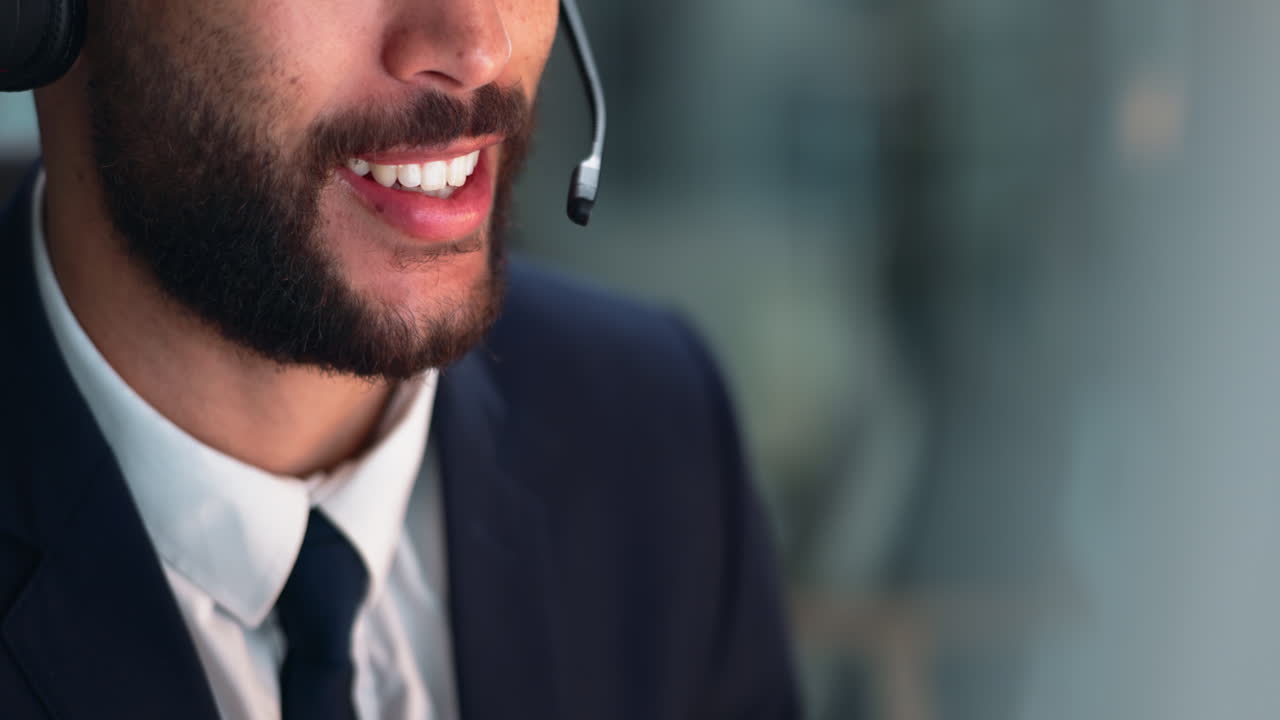 A man providing customer service in a call center