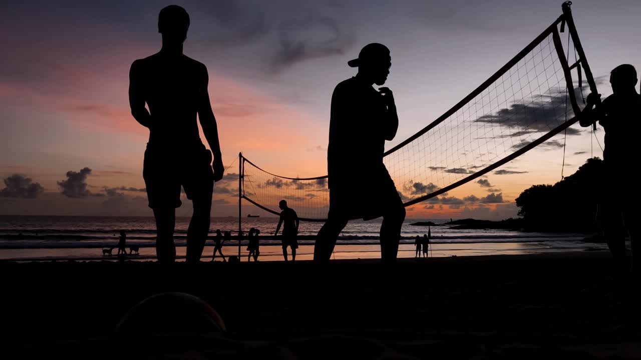 Beach volleyball at sunset