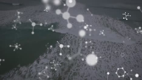 animación de moléculas que caen sobre el paisaje marino