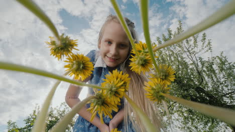 A-Child-Blows-Dandelions-In-A-Meadow