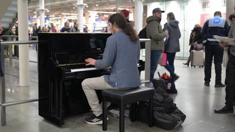 pianist in st pancras, london, united kingdon