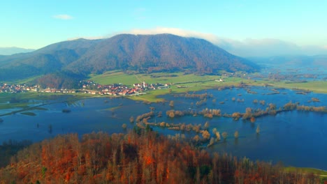 aerial 4k drone footage of a planina plain , slovenia