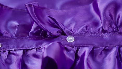 purple ruffles close-up. sewing a violet dress. handmade tailoring, professional clothing concept. abstract background