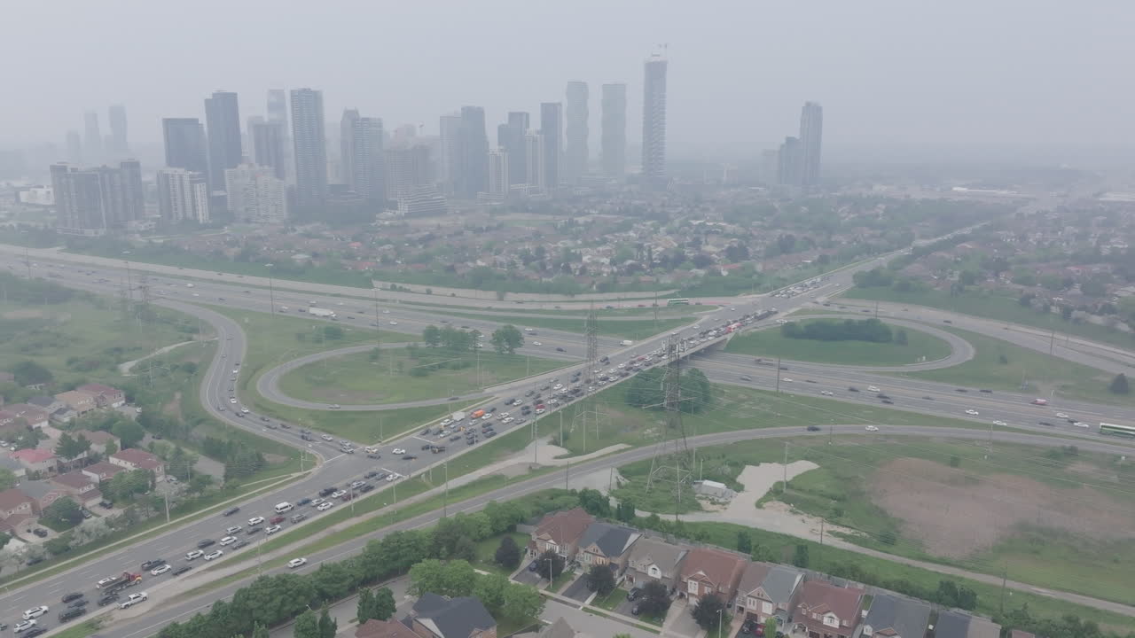 Traffic and buildings in mississauga, hazy due to wildfire smoke, aerial view
