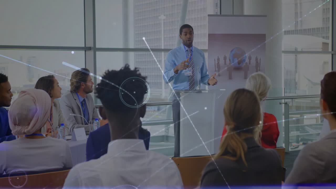 Male presenter placing hands on podium speaking, animating network nodes for business connectivity
