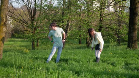 young couple dancing in a park