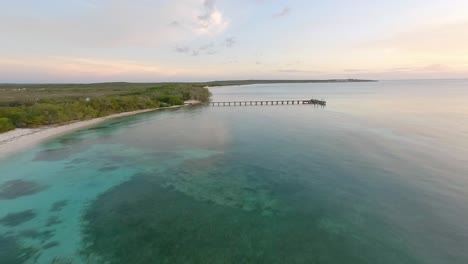 Flying-Over-Paradise-Beach-With-Wooden-Boardwalk-In-Cabo-Rojo,-Puerto-Rico