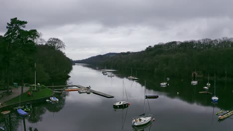 beautiful aerial view, footage of rudyard lake in the derbyshire peak district nation park, popular holiday, tourist attraction with boat rides and water sports on off, peaceful, calm water