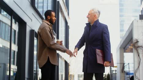 businessmen meeting outdoors