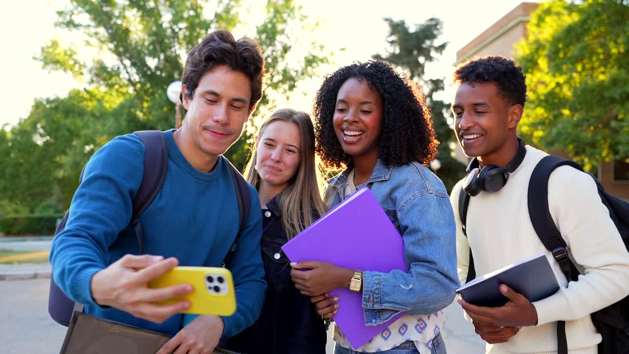 Group of students using a smartphone on campus