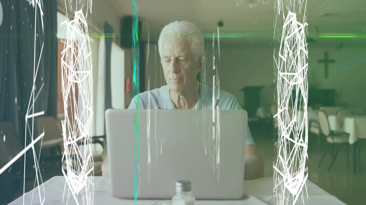 Elderly man working on laptop with digital network animation overlay