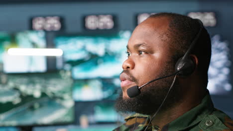 radio communications operator talking in headset mic, close up