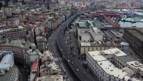 Highway-Road-through-Crowded-Urban-City-of-Genova,-Italy---Aerial-Establishing-View