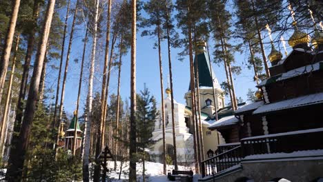 winter scene of a russian orthodox church in a forest