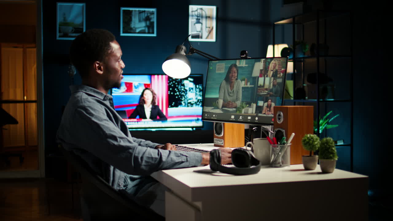 African american remote worker attending a web meeting call in a living room