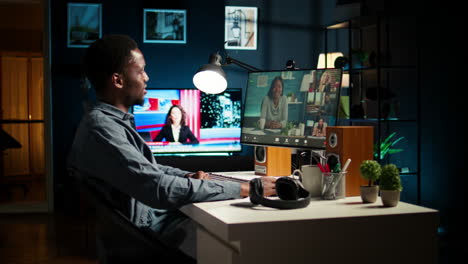african american remote worker attending a web meeting call in a living room