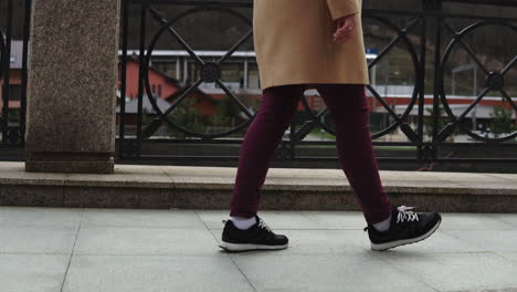 woman walking on city street